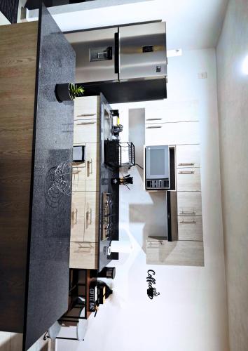 a rendering of a kitchen with a stove top oven at Chantli - Departamento Centro Medico IMSS in Guadalajara