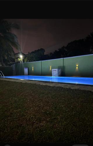 a fence with blue lights on it at night at Bolgoda Lake Villa in Moratuwa