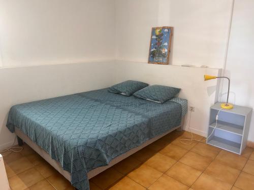 Postel nebo postele na pokoji v ubytování Logement indépendant St leu dans les bas