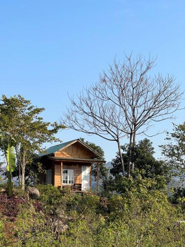 a small house on top of a hill at MAMA's House Mộc Châu in Mộc Châu