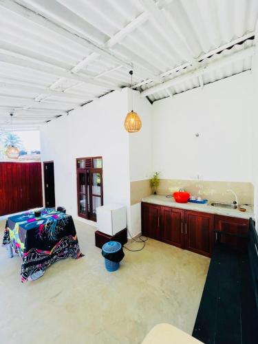 a living room with a sink and a table at Lagoon view resort in Ahangama