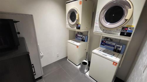 a small room with a microwave and a refrigerator at Hotel Royal Garden Kisarazu / Vacation STAY 72221 in Kisarazu