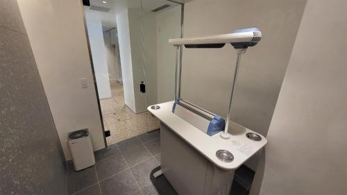 a bathroom with a white sink and a mirror at Hotel Royal Garden Kisarazu / Vacation STAY 72219 in Kisarazu