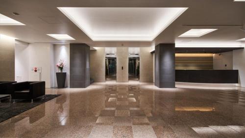 a lobby of a building with a hallway with columns at Hotel Royal Garden Kisarazu / Vacation STAY 72210 in Kisarazu