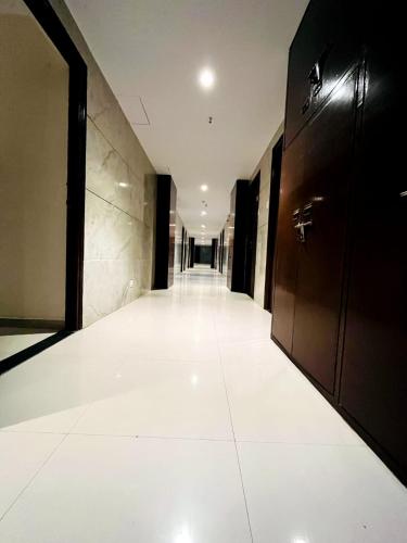 an empty hallway of a building with a hallway at Sunrise cave in Surat