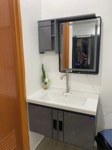 a bathroom with a sink and a mirror at D'Horizon Mountain Resort in Samboan