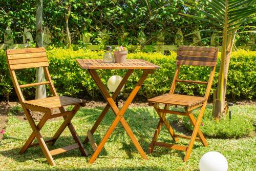 two chairs and a table and a table and chairs at Hayce Residence Ocean View Apartment in Kilifi