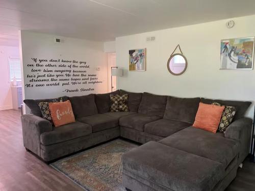 a brown couch sitting in a living room at Lovely One Bedroom Apartment in Merrillville