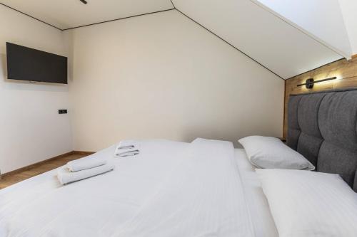 Ένα ή περισσότερα κρεβάτια σε δωμάτιο στο Hotel Pid Strihoju