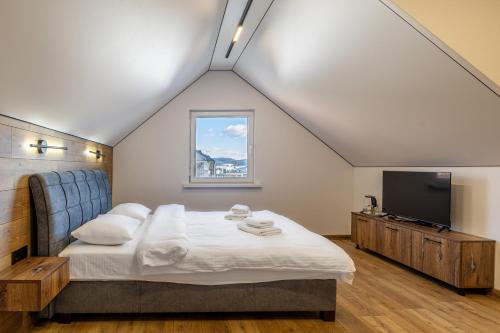 Ένα ή περισσότερα κρεβάτια σε δωμάτιο στο Hotel Pid Strihoju