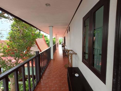 a balcony of a house with a railing at Vimarn Samed Resort in Ko Samed