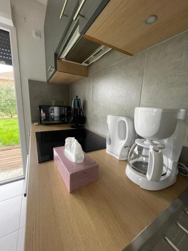 a kitchen with a coffee maker on a counter at Pleasant Garden in Douvaine