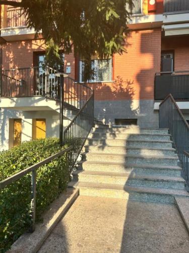 a group of stairs in front of a building at HOME LEOPARDI humanitas,forum,ieo INTERO APPARTAMENTO in Rozzano