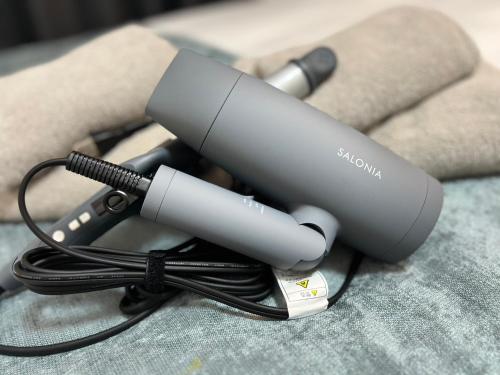 a blow dryer sitting on top of a couch at ラレジダンスドパンテール in Fukuoka