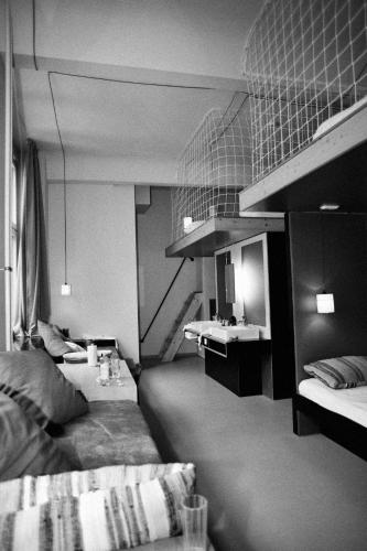 Ένα ή περισσότερα κρεβάτια σε δωμάτιο στο Michelberger Hotel