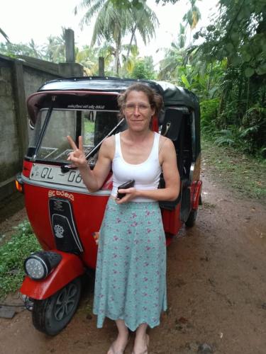 a woman standing in front of a golf cart at Rashini Villa in Beruwala