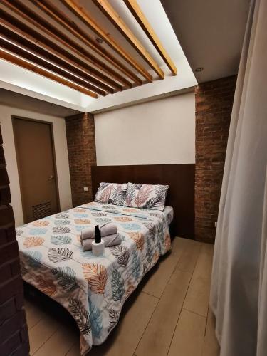 a bedroom with a bed with towels on it at LDN Secret Crib 7D-Two palm tree across NAIA Terminal 3 in Manila