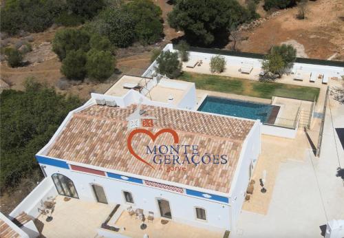 an aerial view of a house with a sign on the roof at Monte Gerações - Heated pool - Typical Algarvian - close to Quinta Lago, Vale Lobo and Vilamoura in Almancil