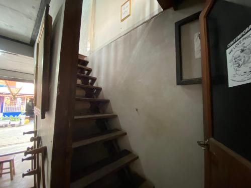 a stairway in a room with a stair case at HostelBed and Art Space Phichai in Phichai