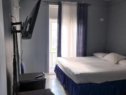 Ένα ή περισσότερα κρεβάτια σε δωμάτιο στο Ocho Rios Seaview Retreat