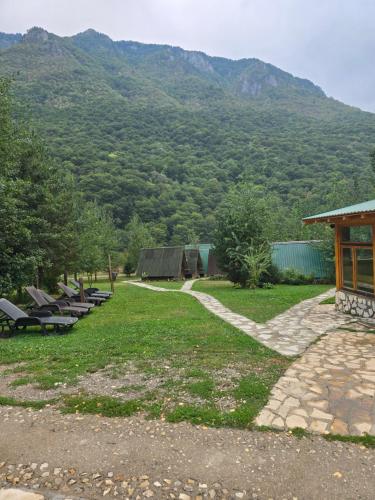 a picnic area with a view of a mountain at Rafting kamp Ivona in Foča