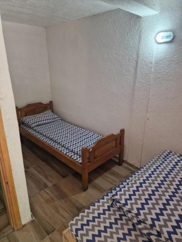 a bedroom with two beds in a room at Rafting kamp Ivona in Foča