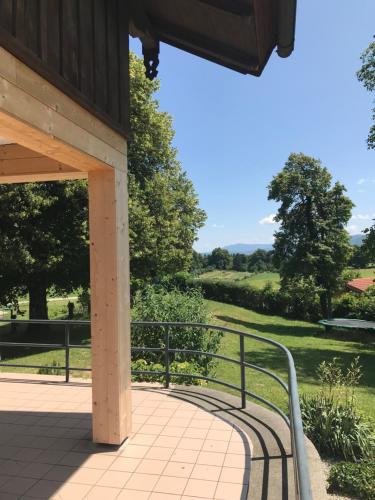 a walkway leading to a pavilion with a view of a park at Ferienhaus Westerbuchberg in Übersee