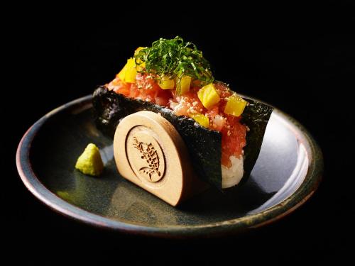 a plate with a piece of food on it at Southwest Grand Hotel in Naha