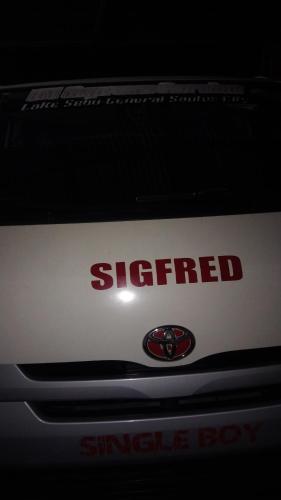 a sign on the side of a car at ramfels car rental ,travel and tour in Siluton