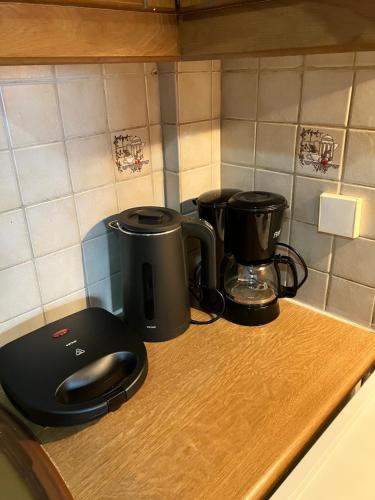 a counter top with a coffee maker and a coffee pot at Seasmiles2 in Paralía Akrátas