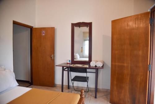 En eller flere senge i et værelse på Urumaya Resort & Eco Farm