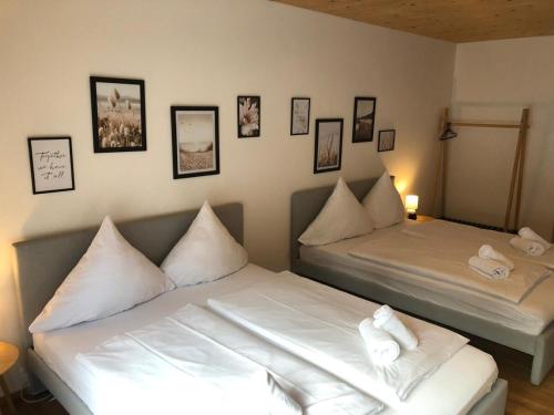 Postel nebo postele na pokoji v ubytování Servus Apartments Donaublick Premium
