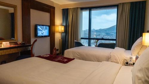 Katil atau katil-katil dalam bilik di فندق الصفوة البرج الأول Al Safwah Hotel First Tower 1