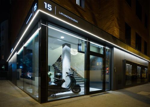 a store front with a scooter in the window at Ilonn Boutique Limanowskiego in Poznań