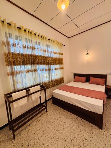 Postel nebo postele na pokoji v ubytování The Grace Cottage - Negombo