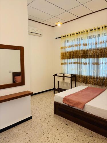 Postel nebo postele na pokoji v ubytování The Grace Cottage - Negombo