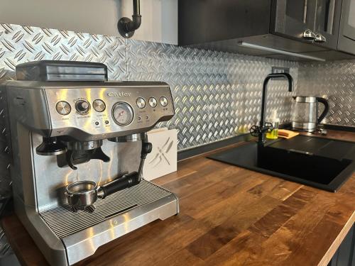 a kitchen with a coffee machine on a counter at Penzio Ostrava in Ostrava