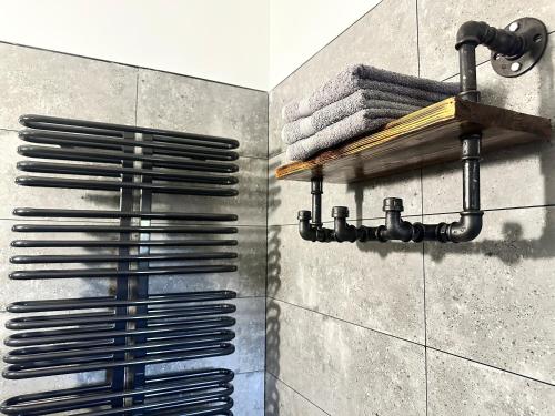 a shower with a metal object on the wall at Penzio Ostrava in Ostrava