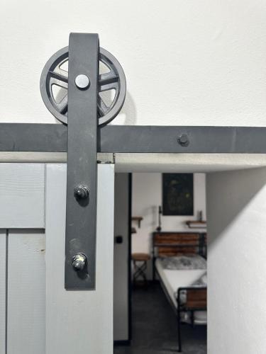 a metal railing on a bed in a bedroom at Penzio Ostrava in Ostrava