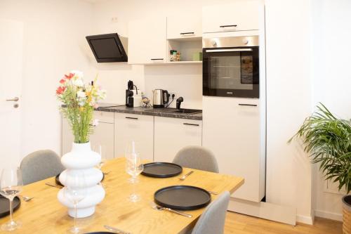 Kuchyň nebo kuchyňský kout v ubytování Urbanes Messe Apartment