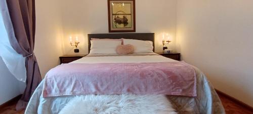 a bedroom with a bed with a teddy bear on it at Tirano Express Comfort Apartment 2P in Tirano