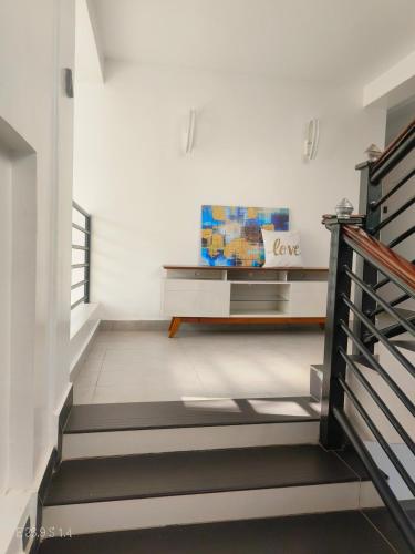 a stairway with a bench in a room at The Royal Hub in Syokimau