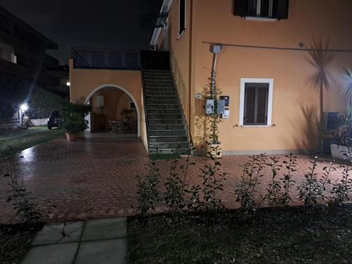 a house with a staircase on the side of it at night at La Casa Di Fiore in Spoltore