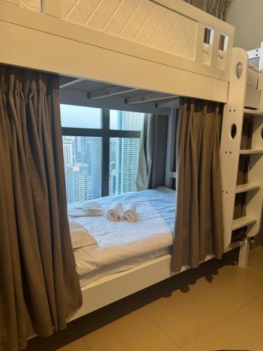 a bunk bed with two towels on top of it at Best view homes in Dubai