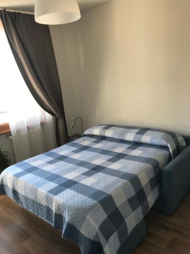 Postel nebo postele na pokoji v ubytování Monolocale a Torre Pellice