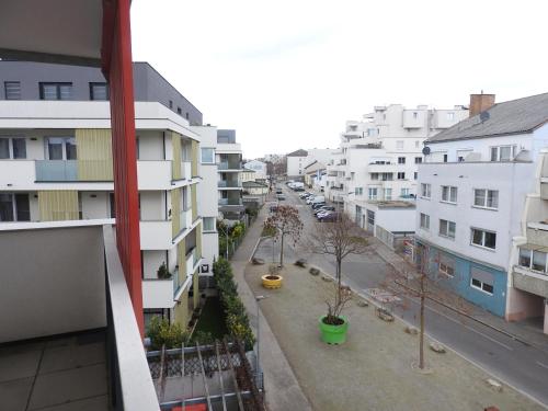 a view of a city street with buildings at Wien Schwechat Apartment Airport in Schwechat