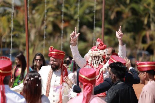 a man standing in a crowd with his hands in the air at Quad Club - Resort and Spa, Nandi Hills in Nandigunda