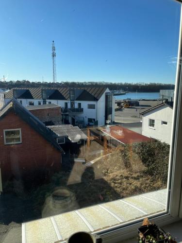 a view of a city from a window at Holiday Home Penthouse Lemvig in Lemvig