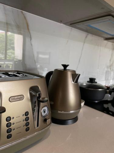 a toaster sitting on a counter in a kitchen at 106 at Boulevard Edge, Zimbali Lakes Resort in Ballito