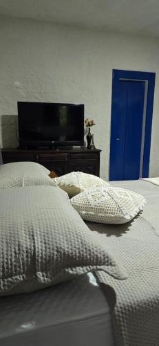 Postel nebo postele na pokoji v ubytování Suítes Sabor e Mar